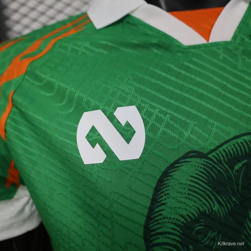 Player Version 2025 Ivory Coast Green with Elephant Graphic and Orange Trim Jersey